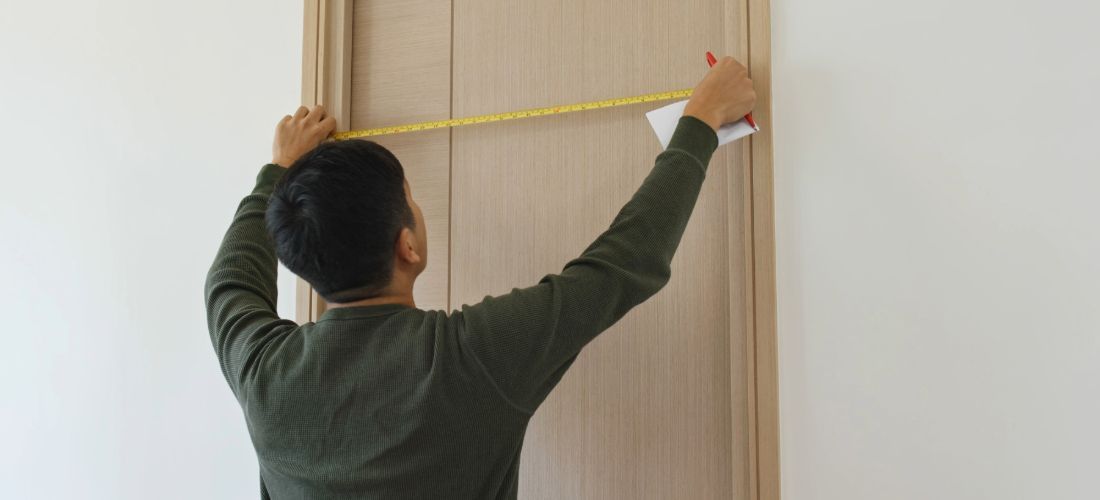 Man Measuring External Door