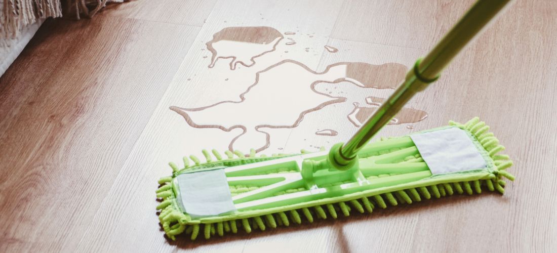 Green mop, mopping up water