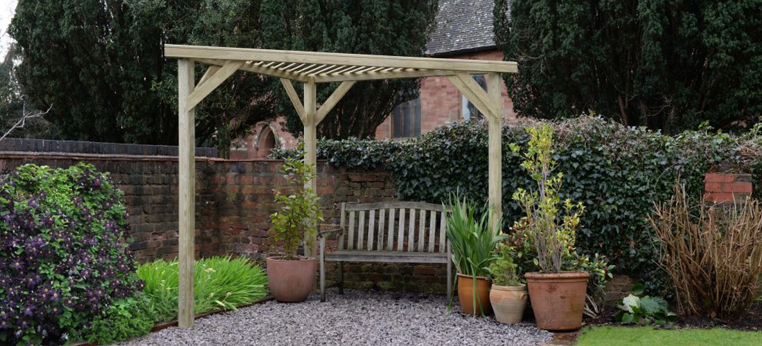 Pergola in corner of garden