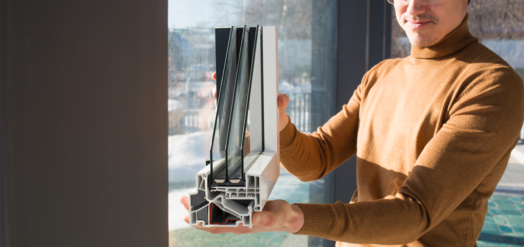 Man holding triple glazed unit