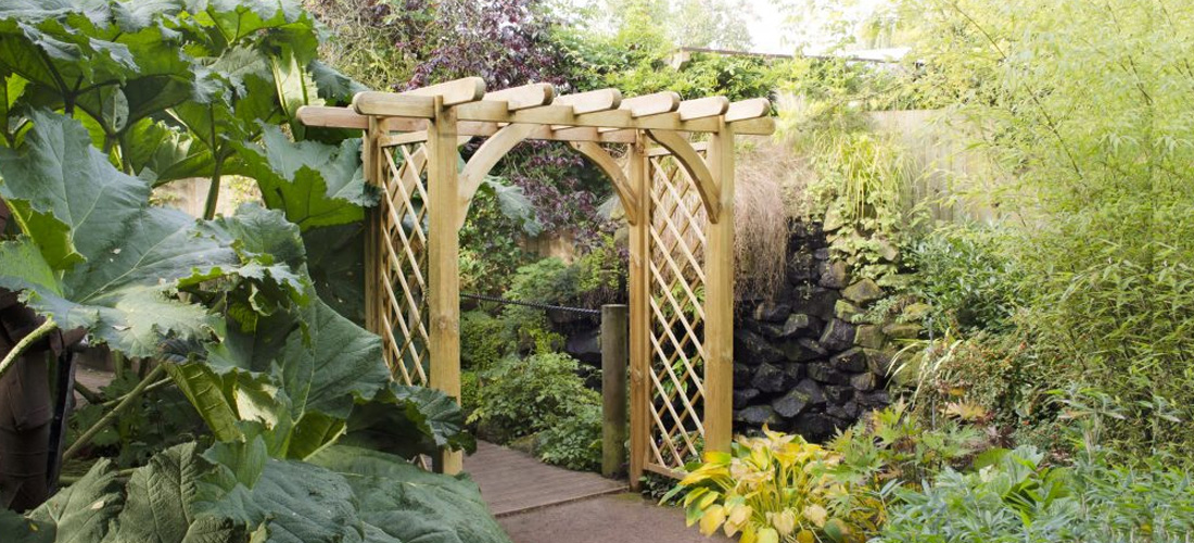 Pergola archway surrounded by green plants