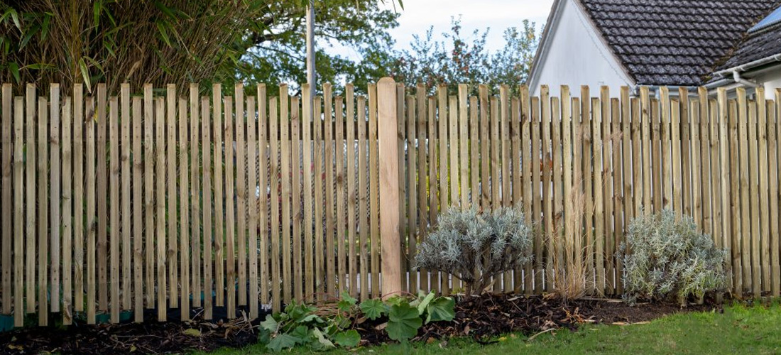 Picket fencing along garden border