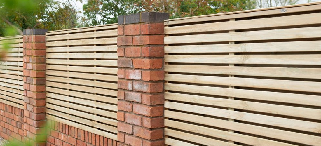 Double slated fencing in garden