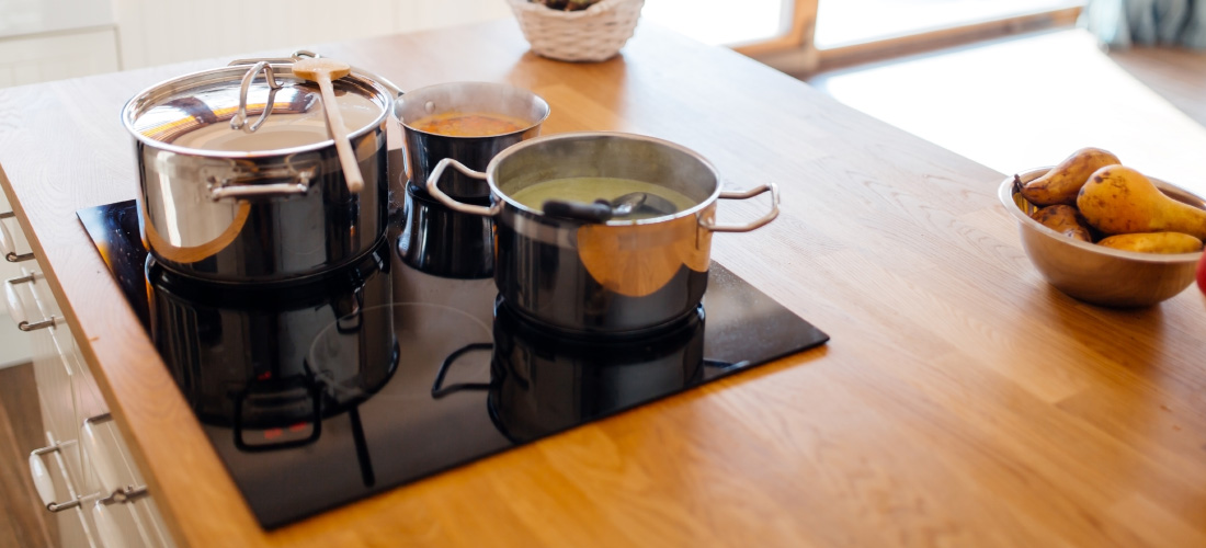 Solid worktop with pans and hob