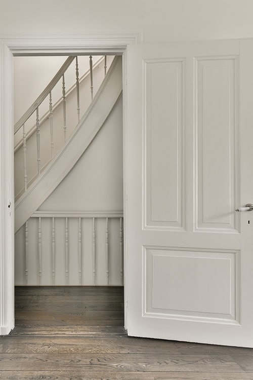 White interior door leading to hallway.