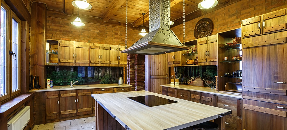 Luxury kitchen with wooden styling and large island.