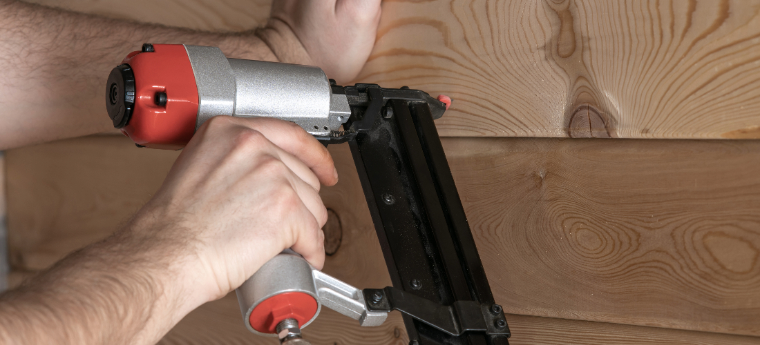 Man using tools for installing insulation